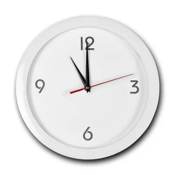 Large round white wall clock with white frame. The hands point to 11 o'clock. Stock-Fotos