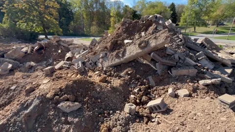 A Large Rubble Pile of Sidewalk or Concrete Stock Footage 319444378