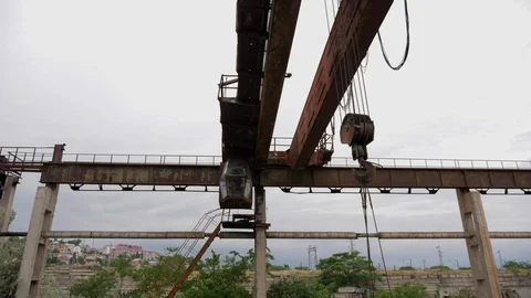Large rusty building equipment on old concrete supports Stock Footage 115236311