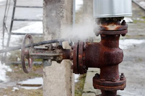 Large rusty valve is broken. Stock Photos