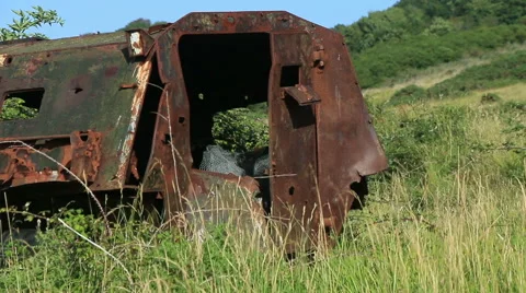Large rusty vechicle behind long grass 6 Stock Footage 40732058