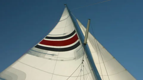 A large sail flaps in the wind in 4K Stock Footage 42441952