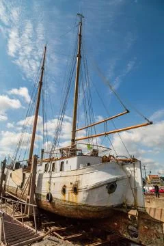 Large sailing boat in dock Stock Photos