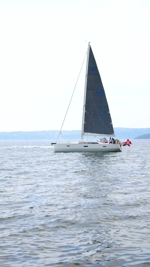 Large Sailing boeat crossing in the wind Norway summer overcast day vertical Stock Footage 201684020