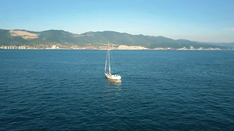 A large sailing ship in the regatta sails across the bay against the backdrop Stock Footage 102654083
