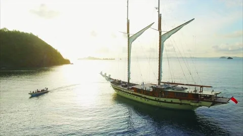 Large sailing ship in the sea at sunset Stock Footage 64130972