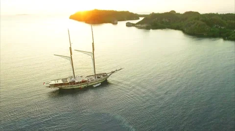 Large sailing ship in the sea at sunset Stock Footage 64131383