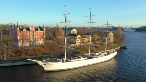 A large sailing ship is tied to the pier. Amazing drone footage of Stockholm Stock Footage 199431331