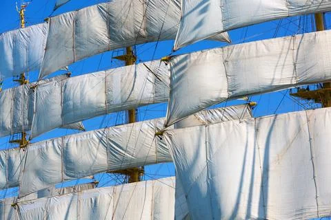 Large Sailing Ship with White Sails Against a Clear Blue Sky 스톡 사진