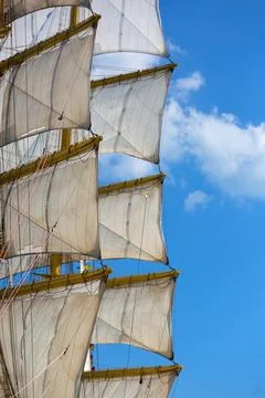 Large Sailing Ship with White Sails Against a Clear Blue Sky Fotos Stock