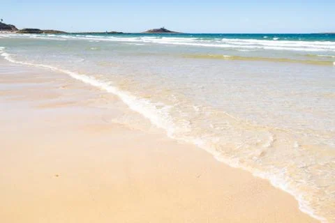 Large sandy beach in the town of "Sables d'or les pins" in Brittany at low ti Stock Photos