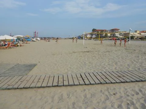 Large sandy beach with volleyball nets Stock Photos