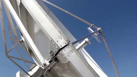 Large Satellite Dish Against Clear Blue Sky at Television Station - 4K Stock Footage 278938771