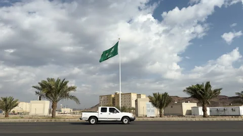 Large Saudi Flag Waving Under Cloudy Skies Stock Footage 343688614