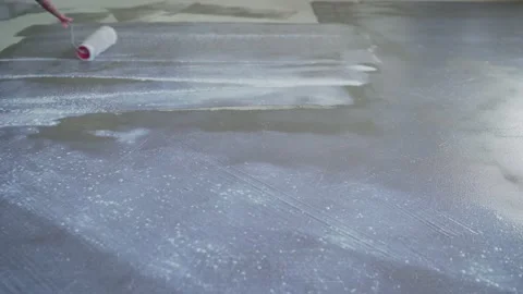 Large scale application of a primer to concrete floors. Stock Footage 162351869