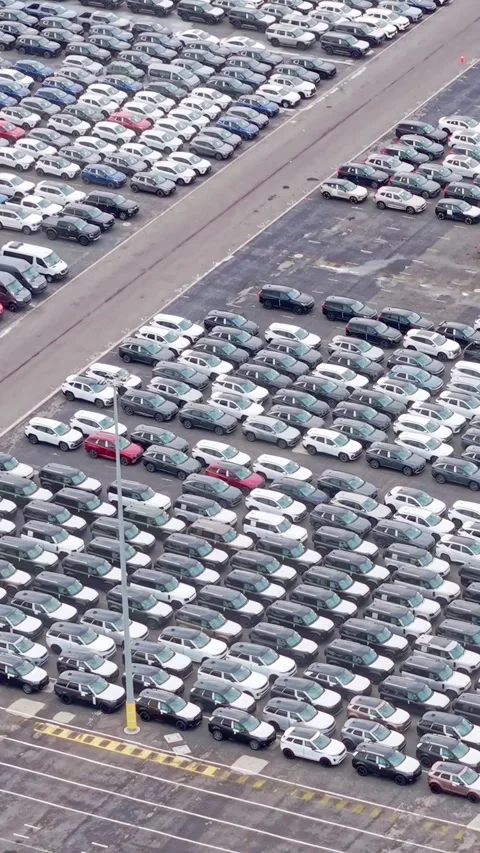 Large-scale car storage lot with rows of vehicles Stock Footage 332778231