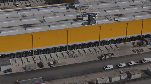 Large scale distribution warehouse near A1 in Po Valley Italy aerial Stock Footage 334351164