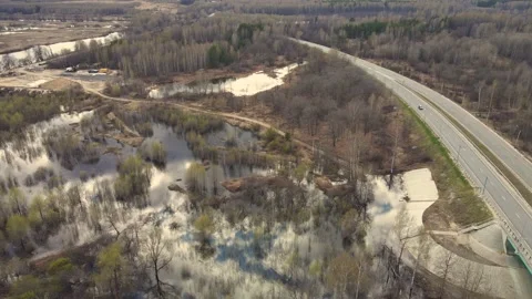 Large-scale flooding of the river, spring flood and flooded fields, aerial view. Stock Footage 225835990