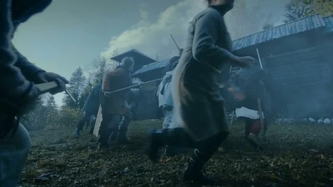 Large-Scale Medieval Battle Reenactment.  Tribe of Warriors Attack Fortress. Stock Footage 82857594