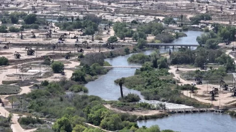 Large Scale Oil Extraction PumpJacks Bakersfield California Drone Aerial Footage Stock Footage 277318211