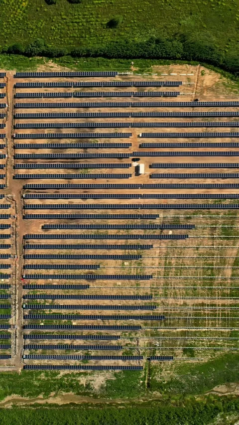 Large scale solar energy plant development on sunny day, top-down aerial Stock Footage 337137907