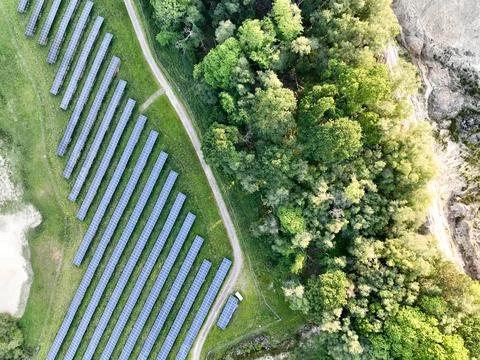 A large-scale solar farm set in a countryside environment Stock Photos