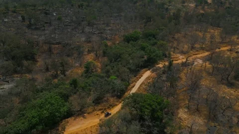 Large Scale Top Down Drone Shot of 4x4 Car over African Landscape Stock Footage 341620939