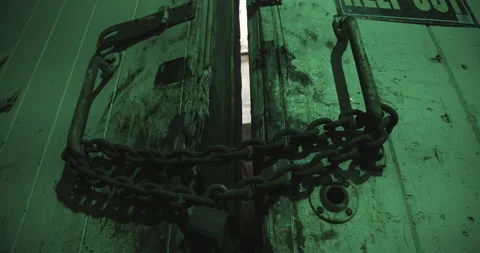 Large Scarey Chained Pad Lock Door in Engine Test Cell Stock Footage 168747425