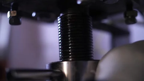 Large screw rotating and compressing material in industrial press. Video stock 313815375