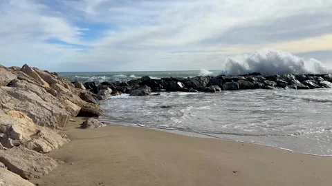 Large sea waves breaking on rocky shore Stock Footage 328171151