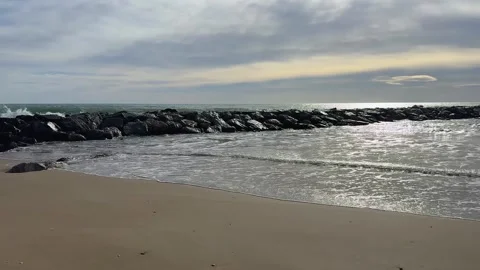 Large sea waves breaking on rocky shore Stock Footage 328171155