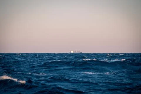 Large sea waves at sunset closeup Stock Photos