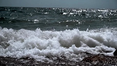 Large sea waves. Video with dark blue ocean water and foam waves. Slow motion Stock Footage 174620589
