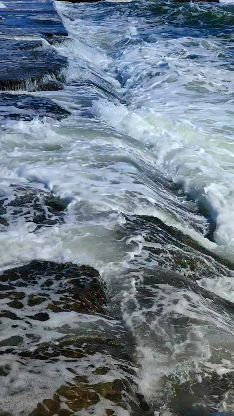Large sea waves white foam hitting splashing concrete pier which people standing Stock-Footage 287403491