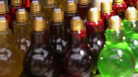 Large selection of assorted beverages in bottles Stock Footage 115077506