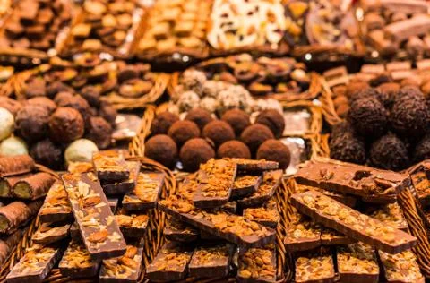 A large selection of different chocolate types at the farmers market stall. Stock Photos