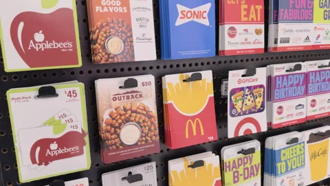 Large selection of gift cards hanging at store 4k Stockbeeldmateriaal 342777596