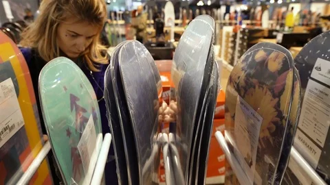 Large selection of snowboards in the store Video stock 82238555