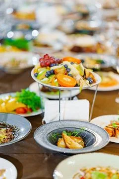 A large served festive table with appetizers. Stock Photos