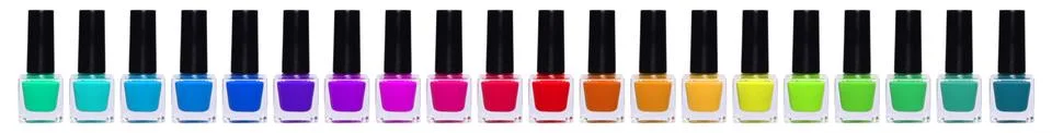 A large set of multi-colored nail polishes. Rainbow jars with nail polish Stock Photos