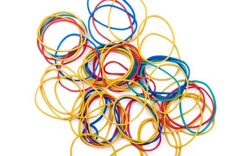 Large set of multi-colored rubber bands photographed on a white background Stock Photos