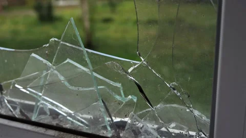  Large shards of glass in a broken window Stock Footage 212117398