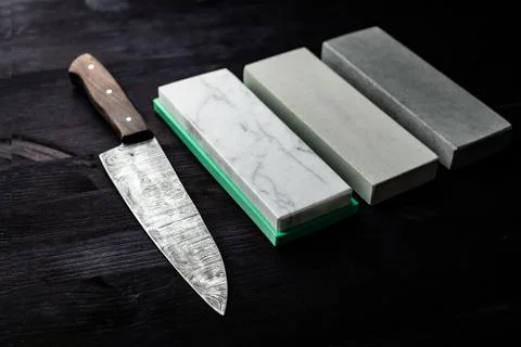 Large Sharp Kitchen Knife And Set Of Sharpening Stones Stock Photos