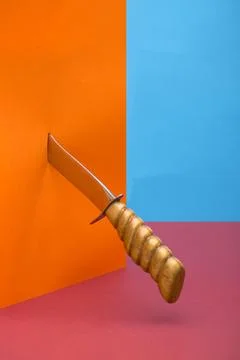 Large sharp knife on a colored background Stock Photos
