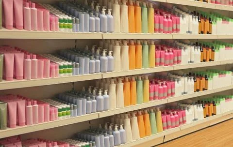 Large shelf inside retail store with cosmetic products Stock Photos