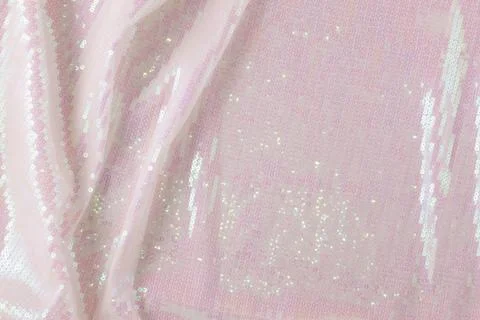Large shiny glossy white sequins background. Stock Photos