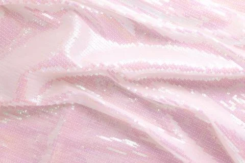 Large shiny glossy white sequins background. Stock Photos