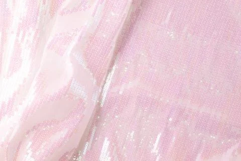 Large shiny glossy white sequins background. Stock Photos