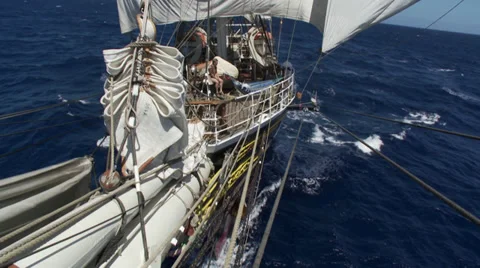 A large ship (a clipper) sailing on open sea, filmed from the stern of the ship, Stock Footage 39483107