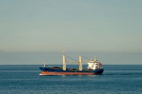 A large ship is currently floating peacefully on a vast body of water Foto stock